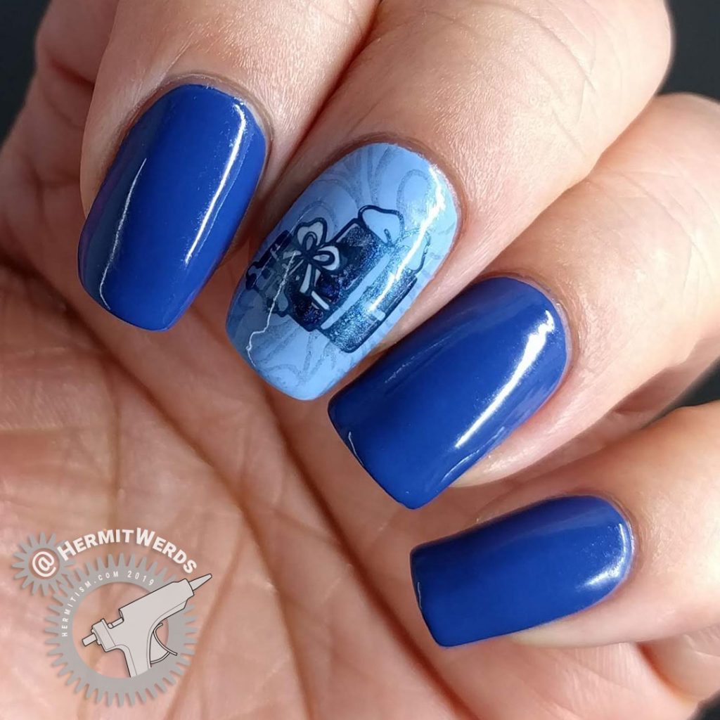 Blue monochrome nail art with Christmas presents and toys.