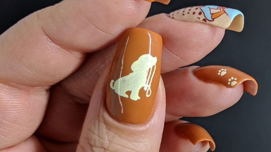 Hazel-colored nail art about walk your dog month with cute dog stamping images and paw prints.