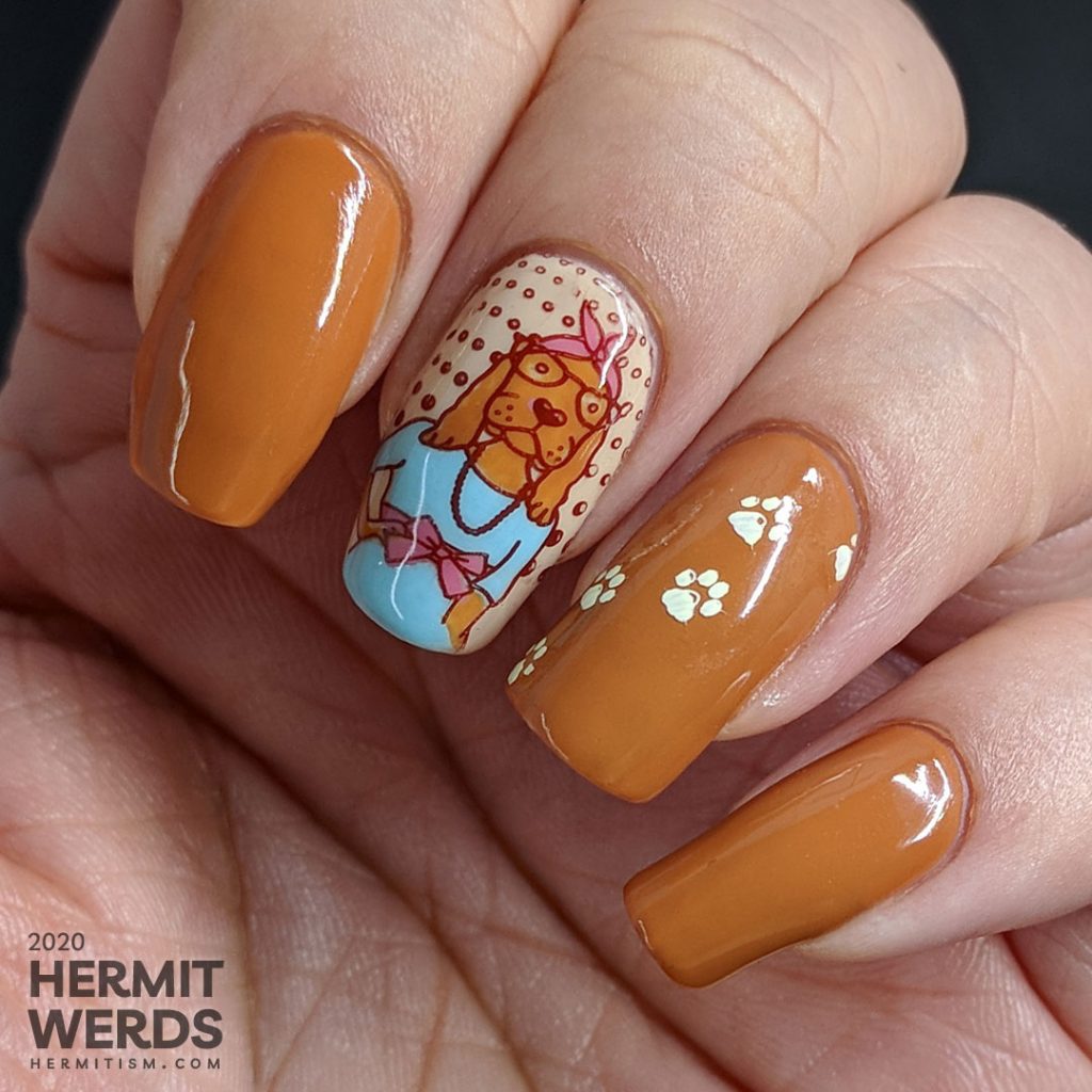 Hazel-colored nail art about walk your dog month with cute dog stamping images and paw prints.