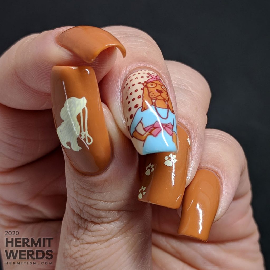 Hazel-colored nail art about walk your dog month with cute dog stamping images and paw prints.
