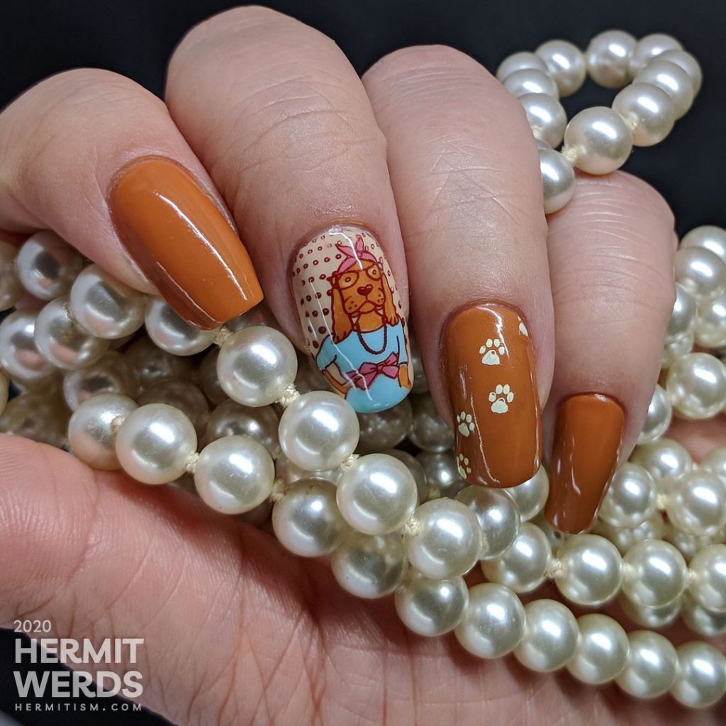 Hazel-colored nail art about walk your dog month with cute dog stamping images and paw prints.