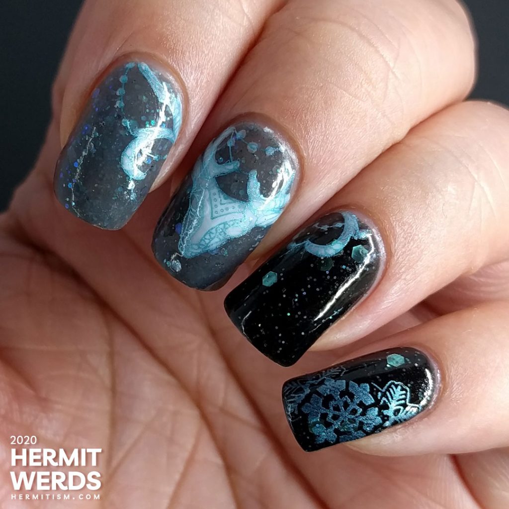 Cold, dark nail art with black and grey crellies filled with aqua hex glitter and the frosty white spirit of a deer.