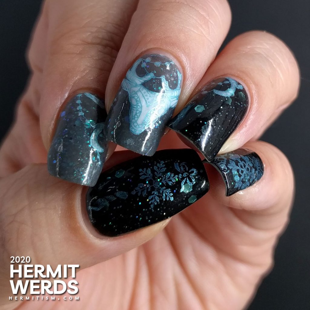 Cold, dark nail art with black and grey crellies filled with aqua hex glitter and the frosty white spirit of a deer.