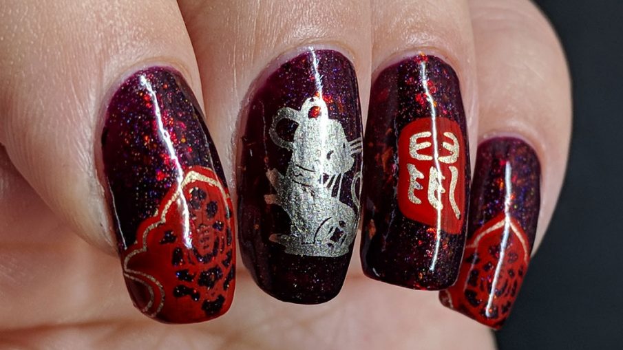 Year of the Rat nail art with a deep red base and Chinese paper cutting stamping images of rats.