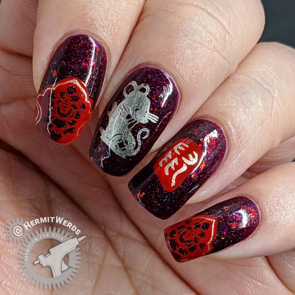 Year of the Rat nail art with a deep red base and Chinese paper cutting stamping images of rats.