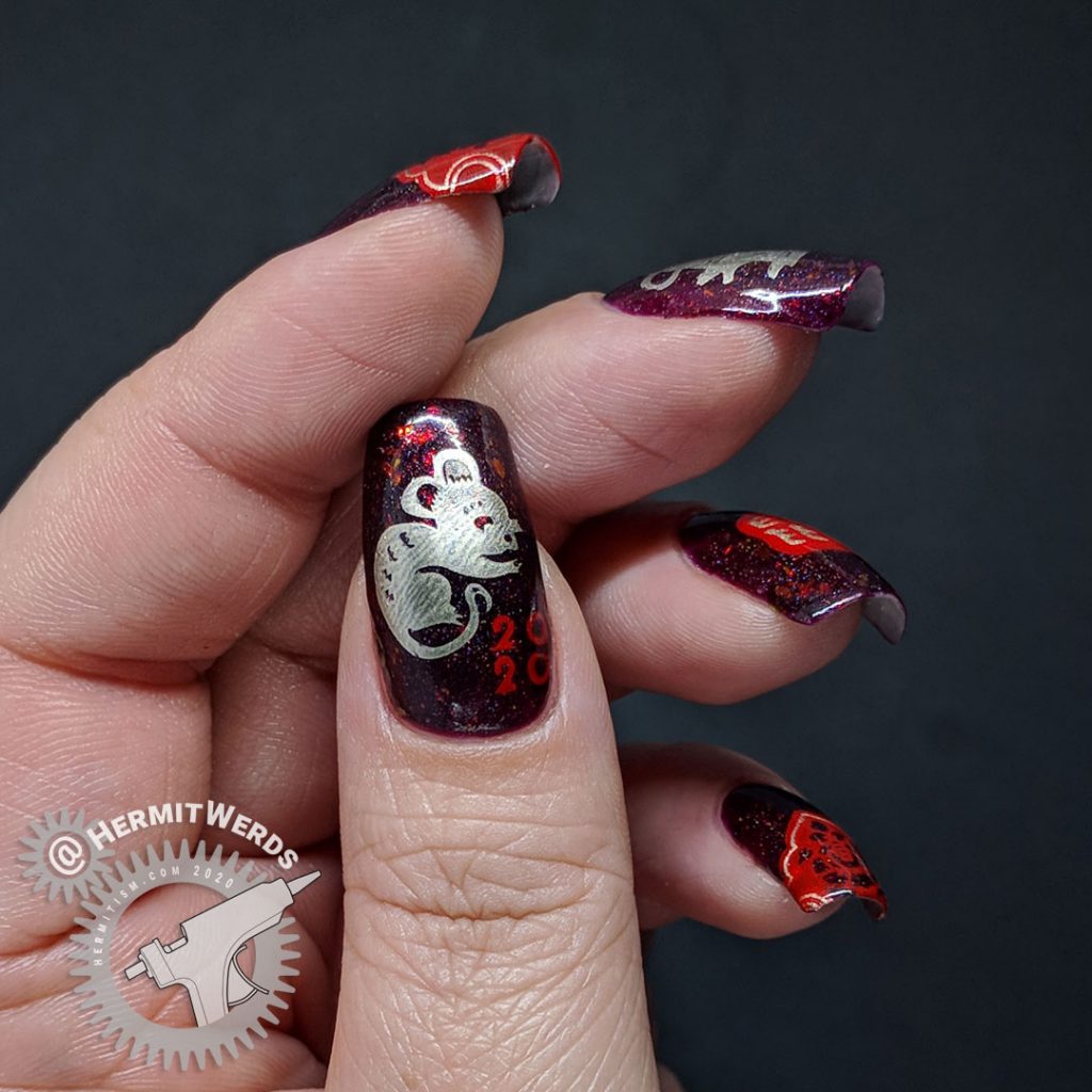 Year of the Rat nail art with a deep red base and Chinese paper cutting stamping images of rats.