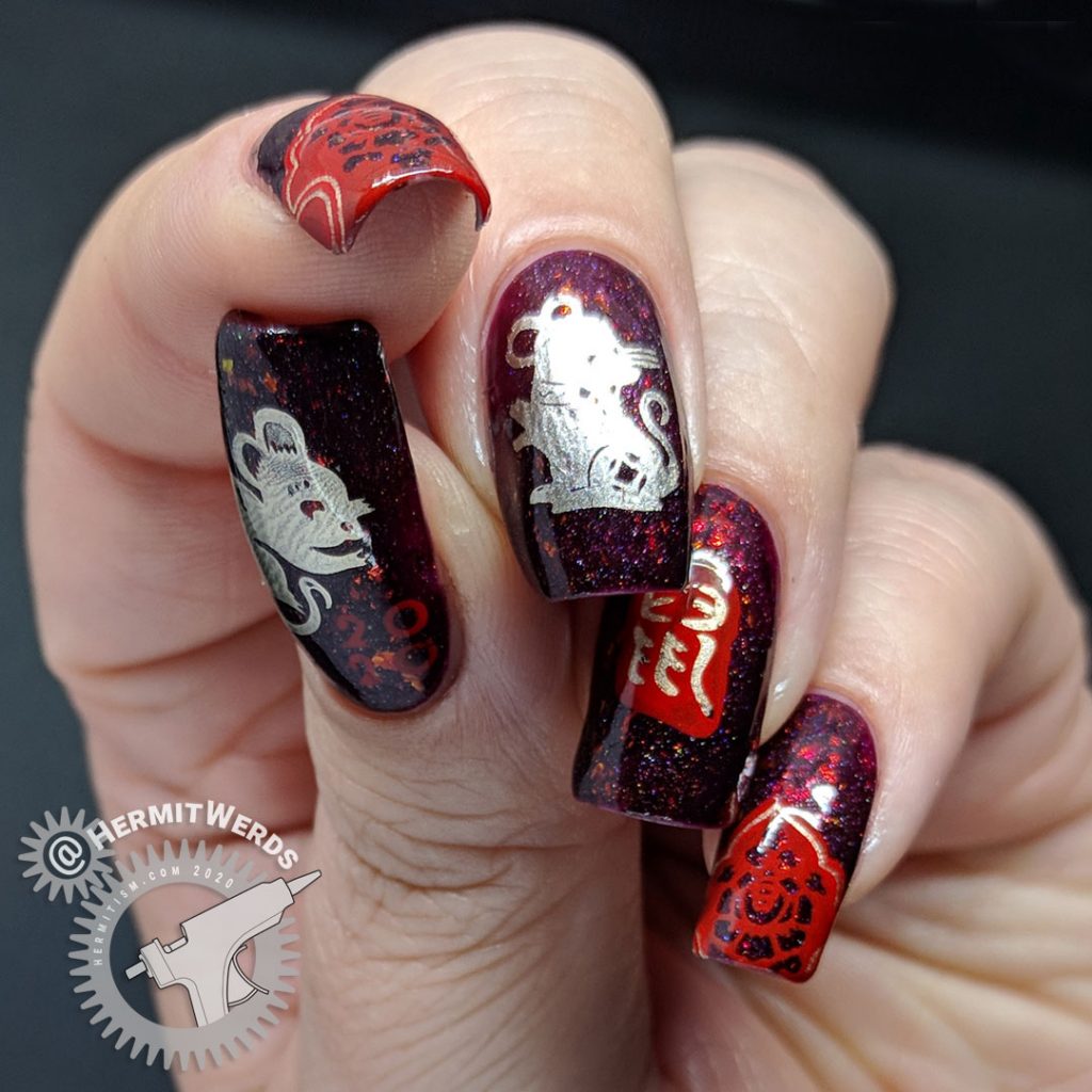 Year of the Rat nail art with a deep red base and Chinese paper cutting stamping images of rats.