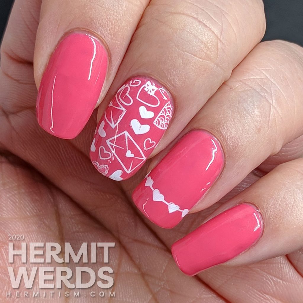 Simple and bright pink nail art with heart and love letters stamping decals.