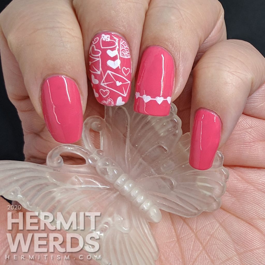 Simple and bright pink nail art with heart and love letters stamping decals.