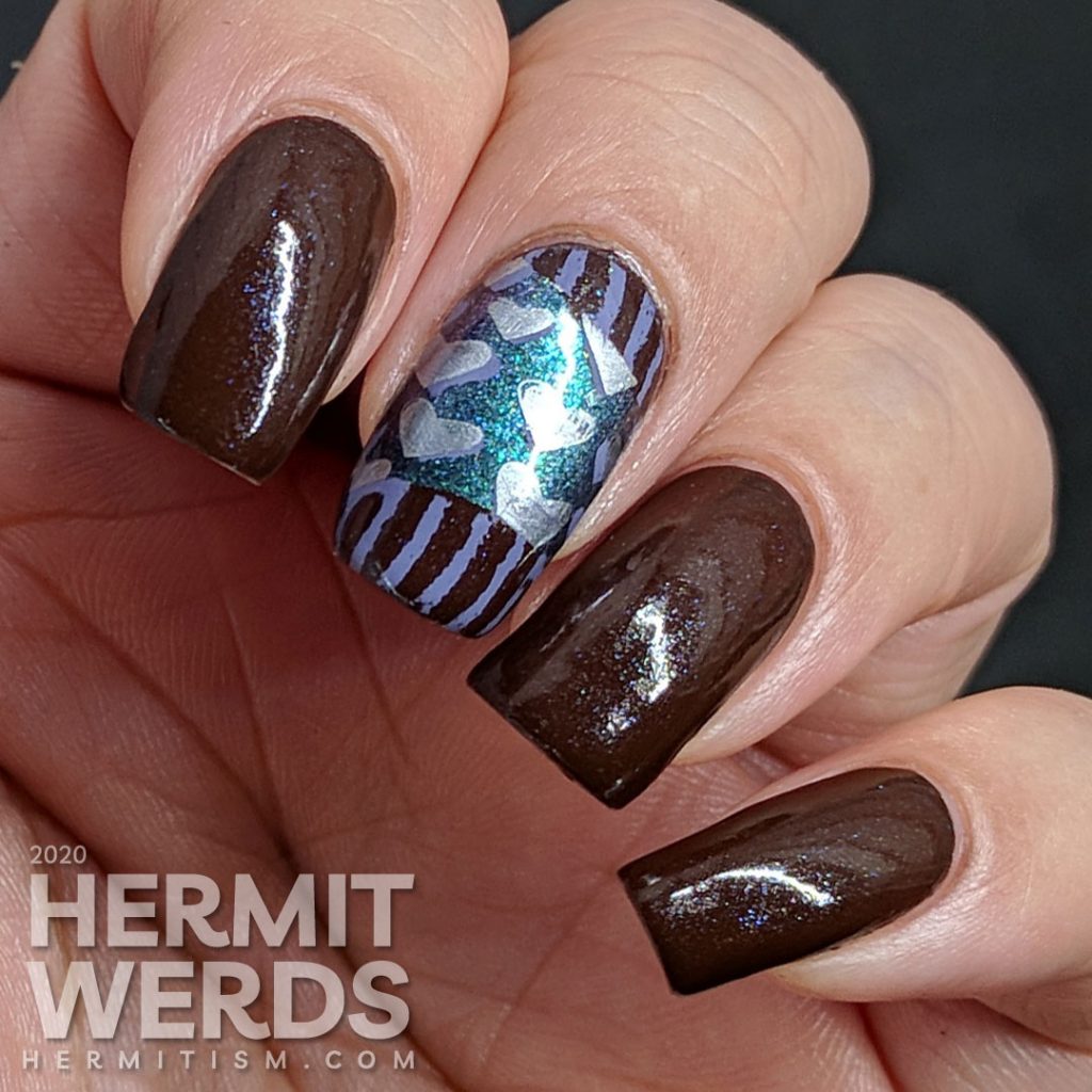 Chocolate-y heart nail art for Valentine's Day in non-traditional colors.