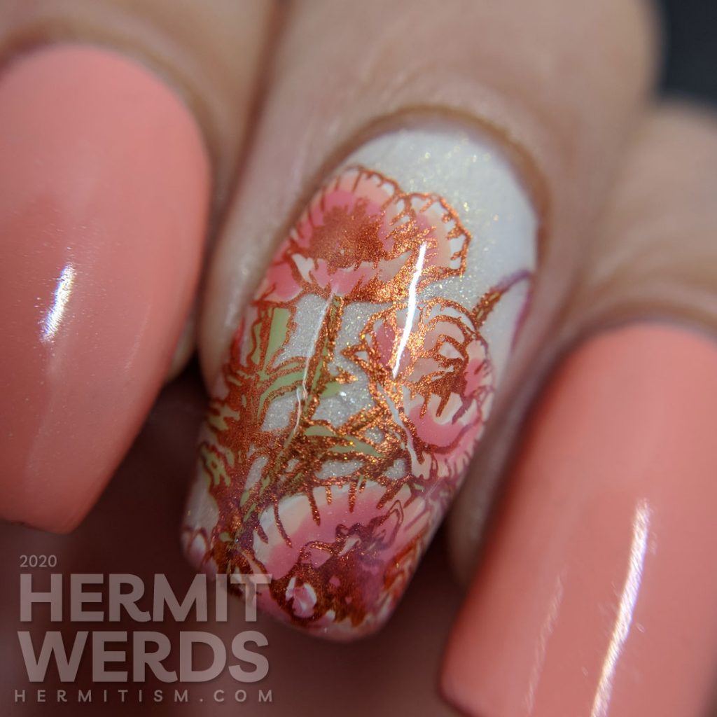 Soft peachy pink nail art with poppy reverse stamped accent nails.