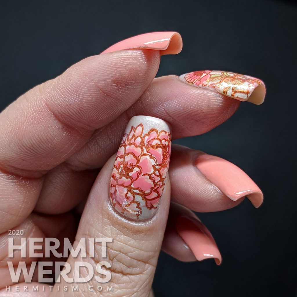 Soft peachy pink nail art with poppy reverse stamped accent nails.