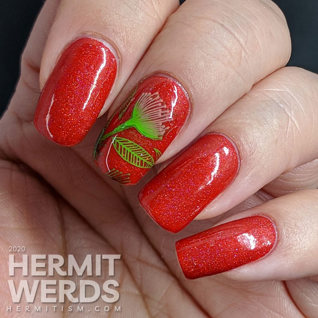 Tomato red nail art with bright green and pink stamped floral and leaf patterns.