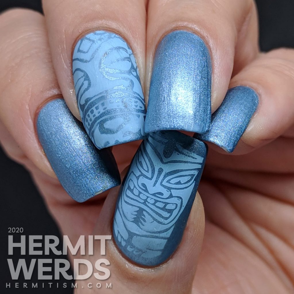 Blue metallic nail art with tribal stamping decals in a light blue.