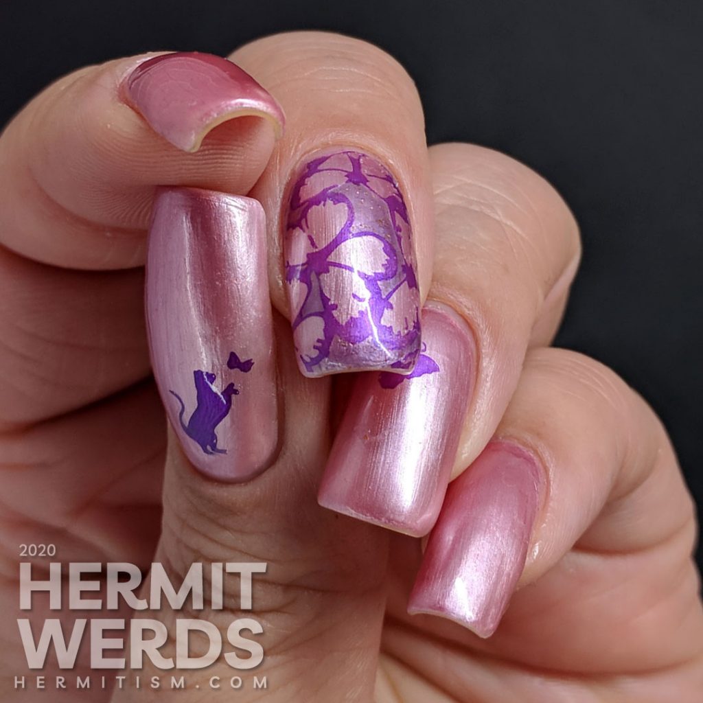 Pearly white/pink sun-activated nail art with purple butterfly stamping.