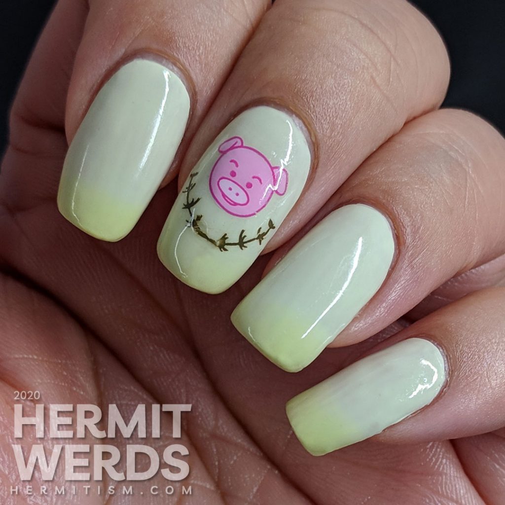 Green thermal nail art with cute pigs stamped on top.