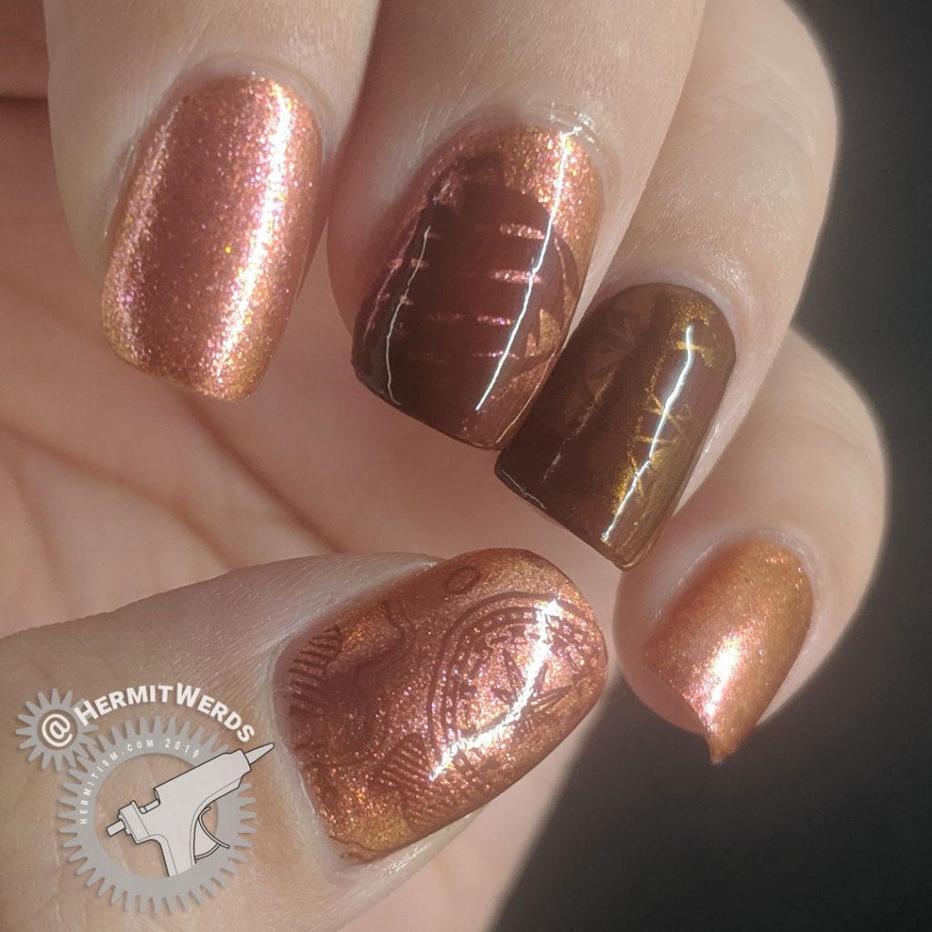 Orange duochrome polish with pirate ship and map stamping decals for Talk Like a Pirate day.