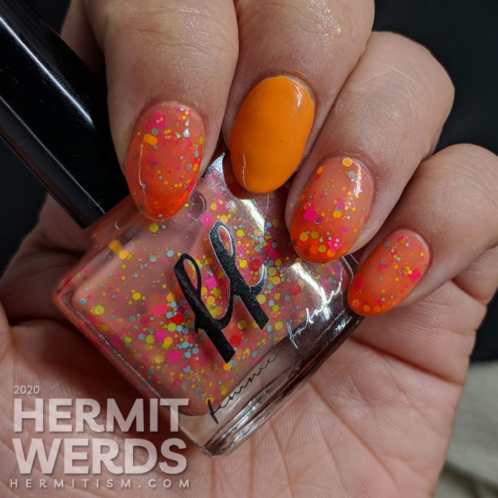 Femme Fatale's "Sour Gummies" orange to nude thermal crelly polish with yellow, orange, blue and pink glitters.