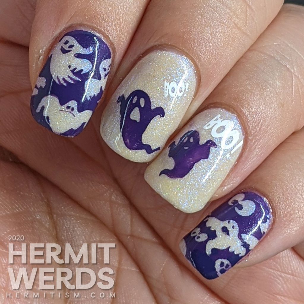 A white and purple ghostly nail art with negative space stamping, boo-ing ghosts and glow in the dark action!