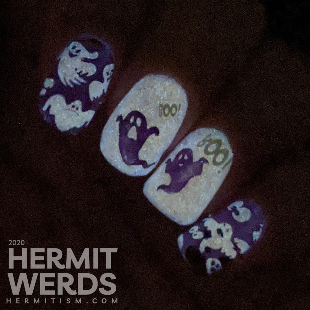 A white and purple ghostly nail art with negative space stamping, boo-ing ghosts and glow in the dark action!