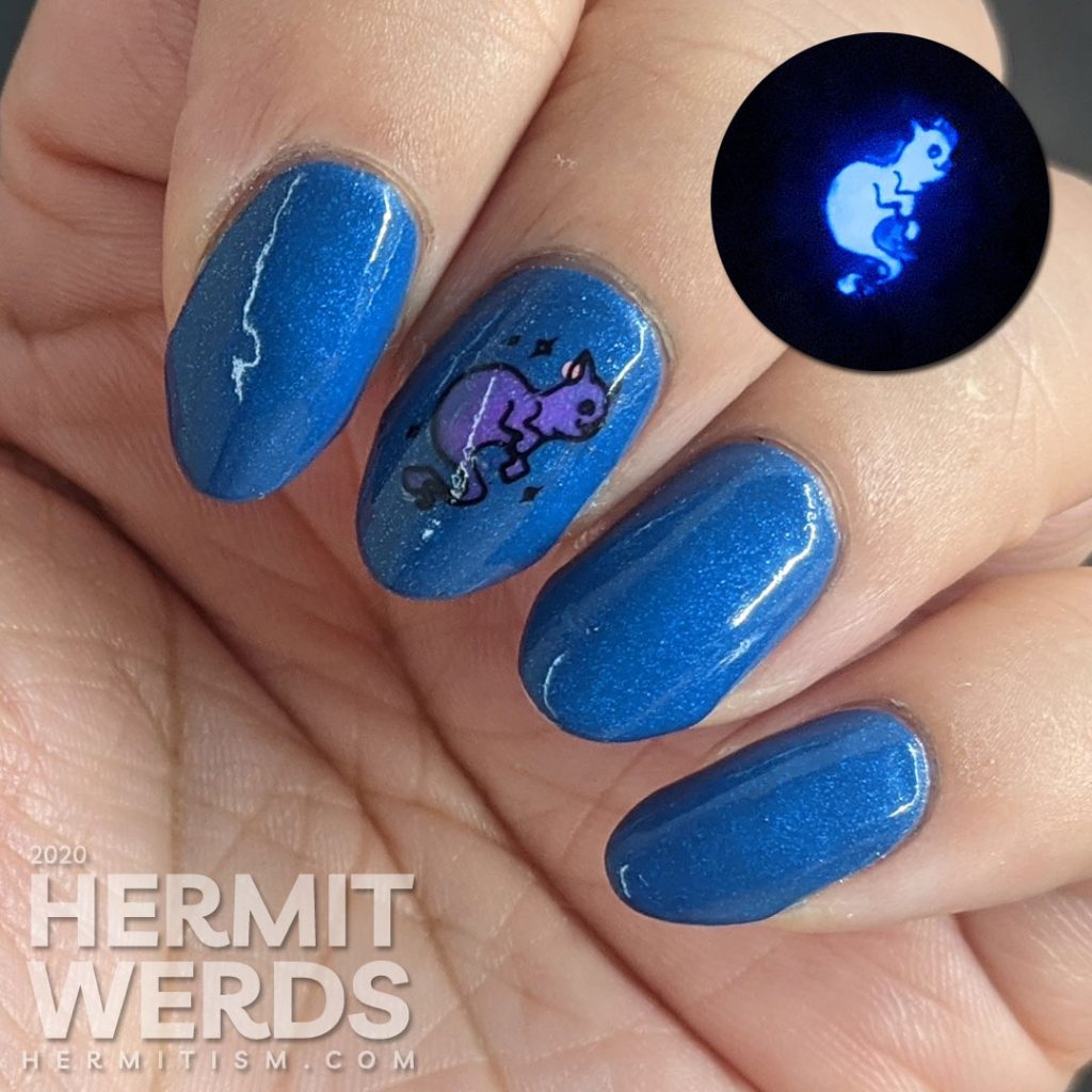 True blue nail art decorated with a rising zombie cat and glow in the dark ghost cat.