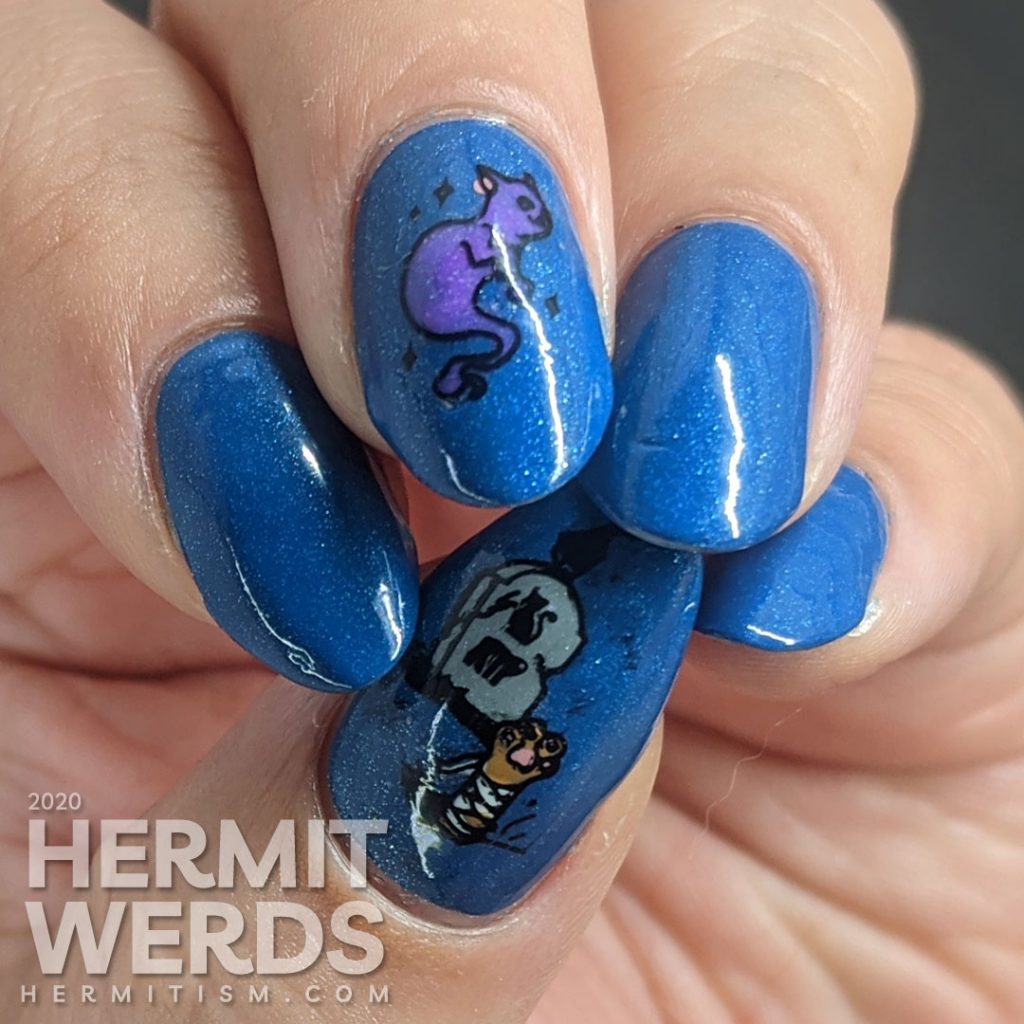 True blue nail art decorated with a rising zombie cat and glow in the dark ghost cat.