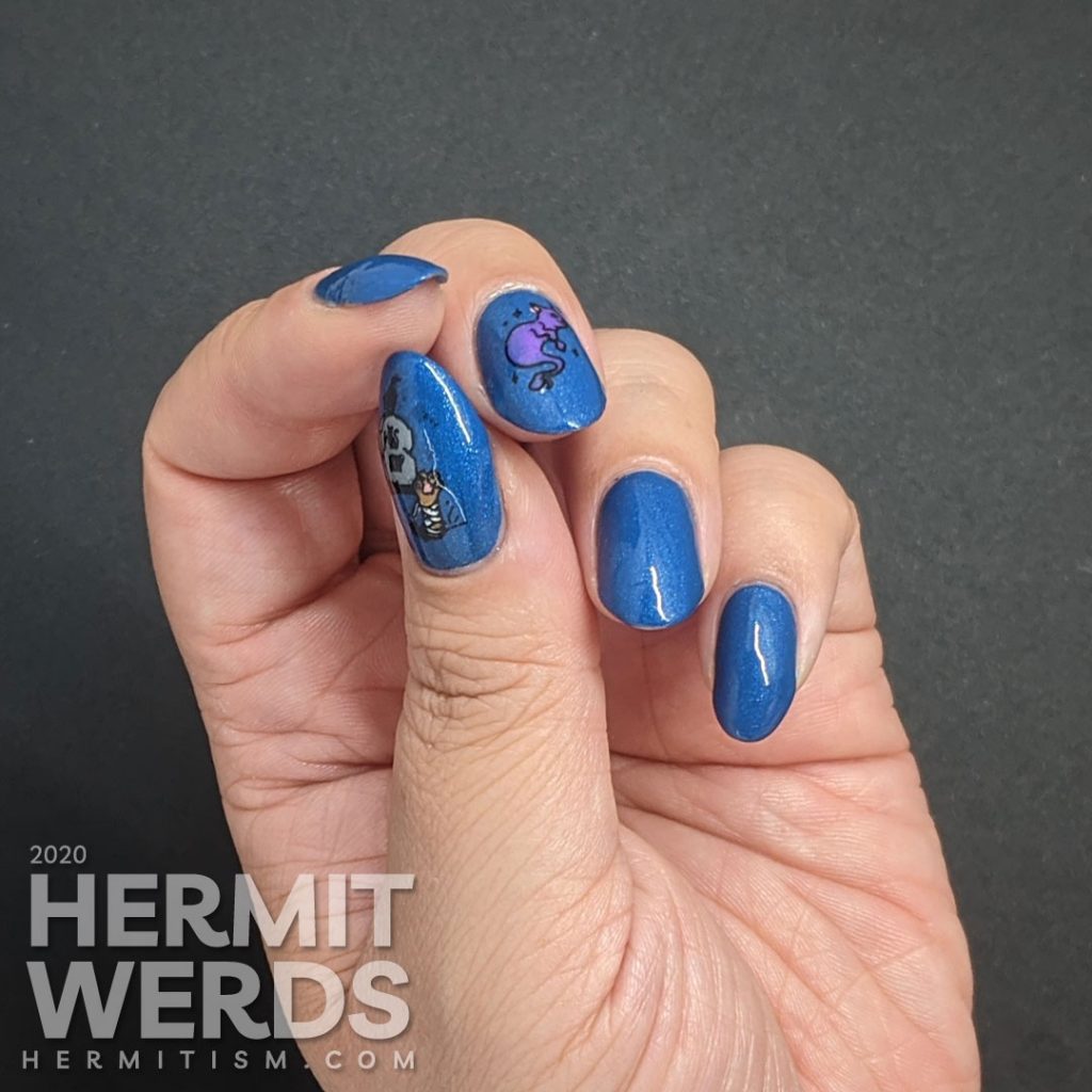 True blue nail art decorated with a rising zombie cat and glow in the dark ghost cat.