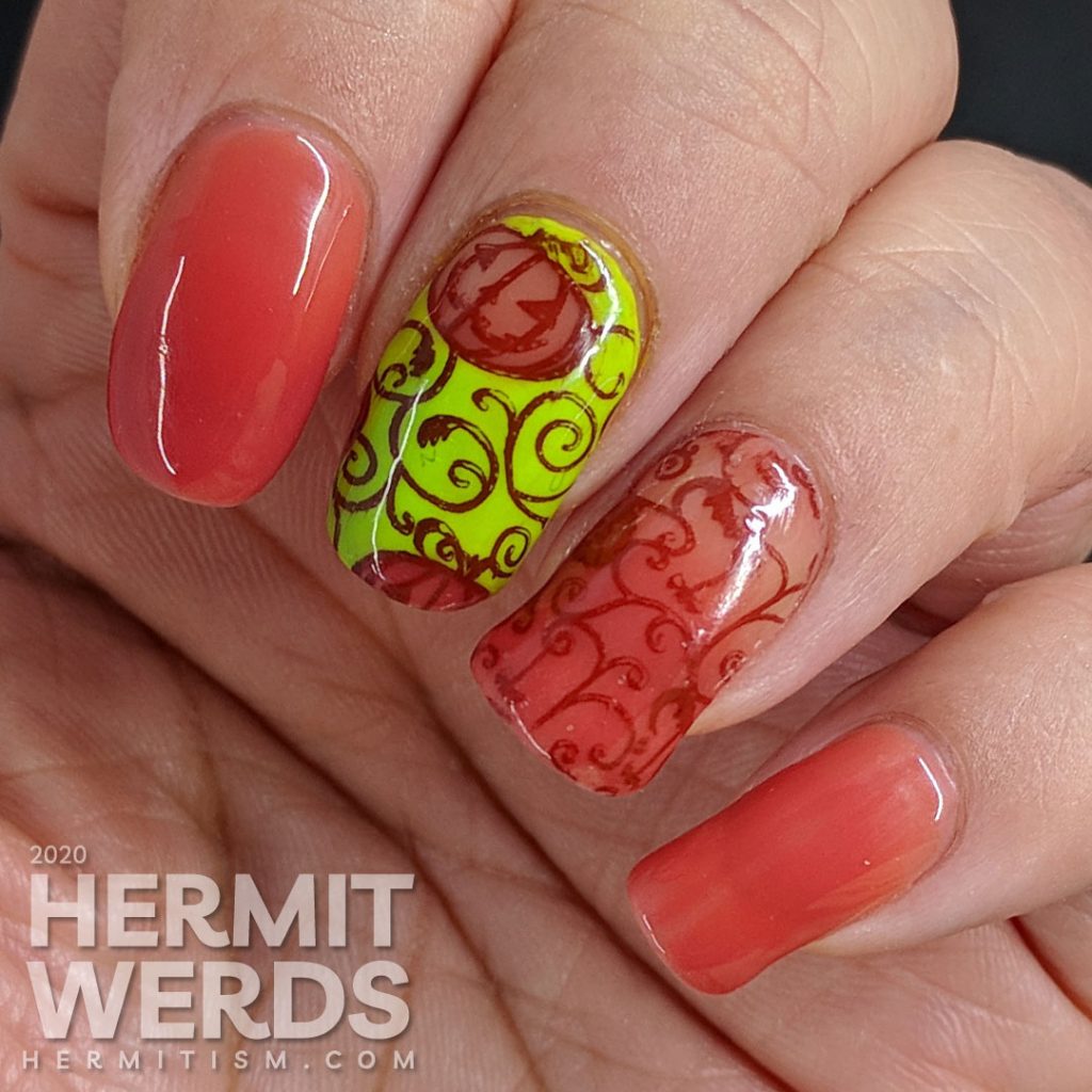 Bright green and coral thermal polish manicure with cute jack-o-lantern pumpkins stamped on top.