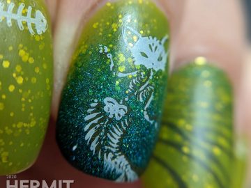 Pugly green nail art with skeletal mermaid cat double stamping decals and a teal to green gradient.