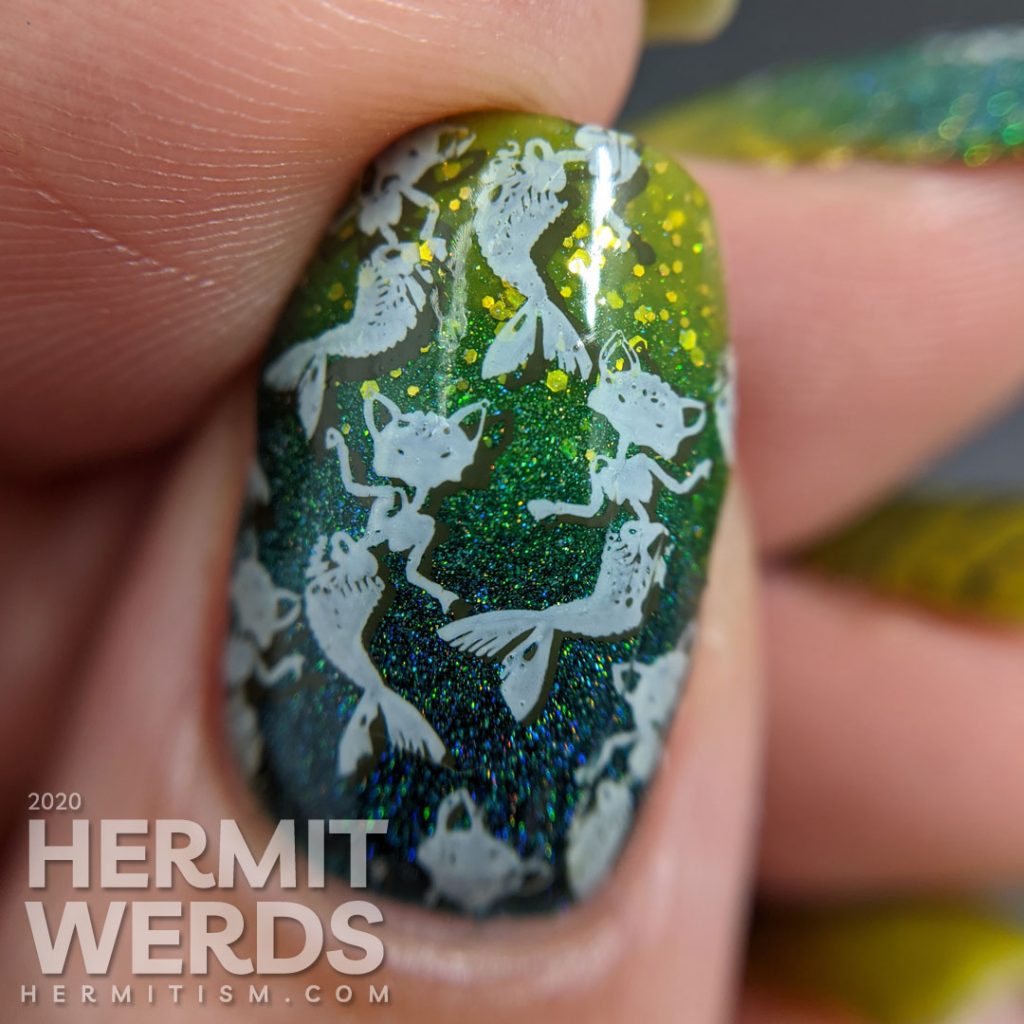 Pugly green nail art with skeletal mermaid cat double stamping decals and a teal to green gradient.