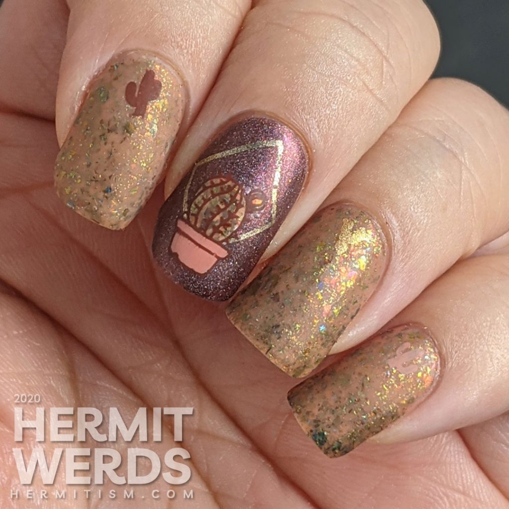 Cactus-themed nail art with a tawny brown and holographic dark red polish and gold geometric frames with potted cacti.