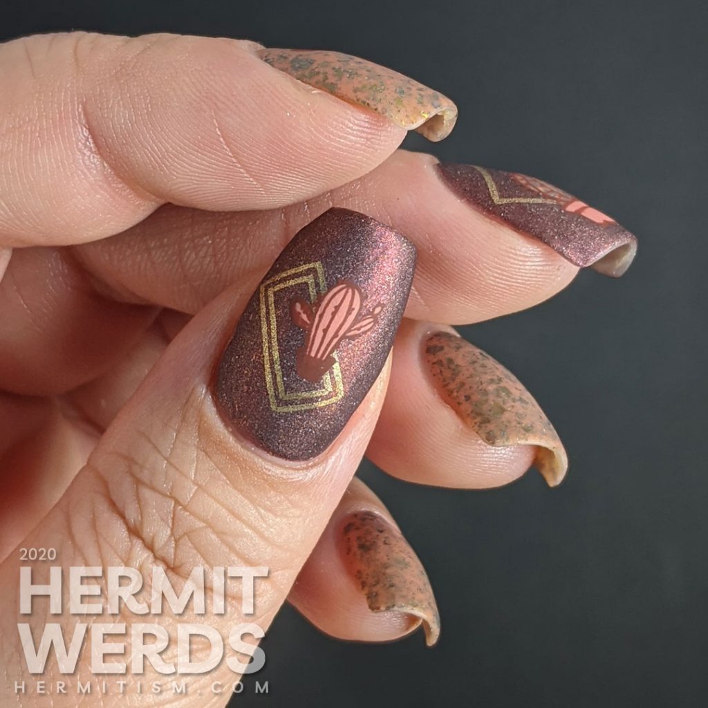 Cactus-themed nail art with a tawny brown and holographic dark red polish and gold geometric frames with potted cacti.