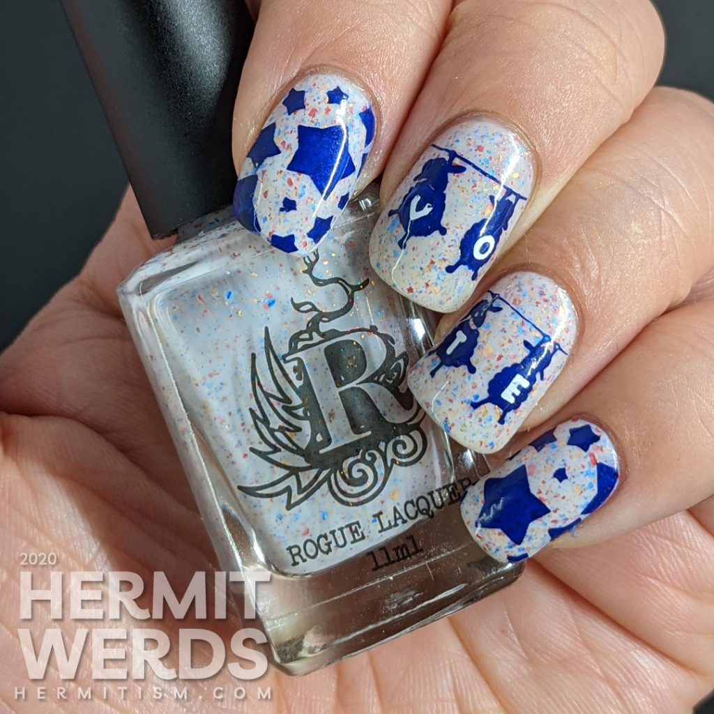 A patriotic red white and blue crelly polish with blue sheep stamped on top and "vote" painted letter by letter on their fluffy sheep bellies.