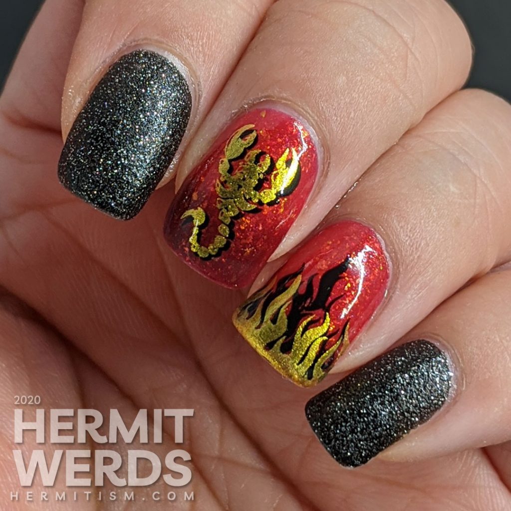 A glow in the dark fire-y thermal red and black nail art with double stamped scorpion and flames and edgy black textured polish accent nails.