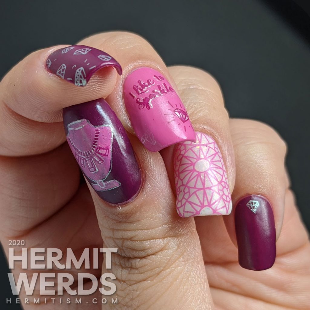 Diamond themed nail art in pinks and purples with an iridescent white crelly accent nail that is covered in faceted gem stamping. "I like to sparkle."