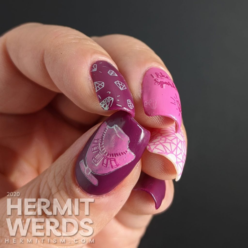 Diamond themed nail art in pinks and purples with an iridescent white crelly accent nail that is covered in faceted gem stamping. "I like to sparkle."