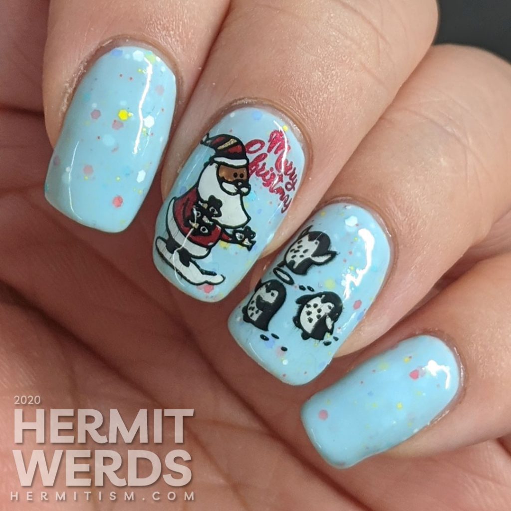 Nail art of Santa handing out fishy presents to cute penguins for Christmas and another penguin celebrating New Years on a blue crelly background.