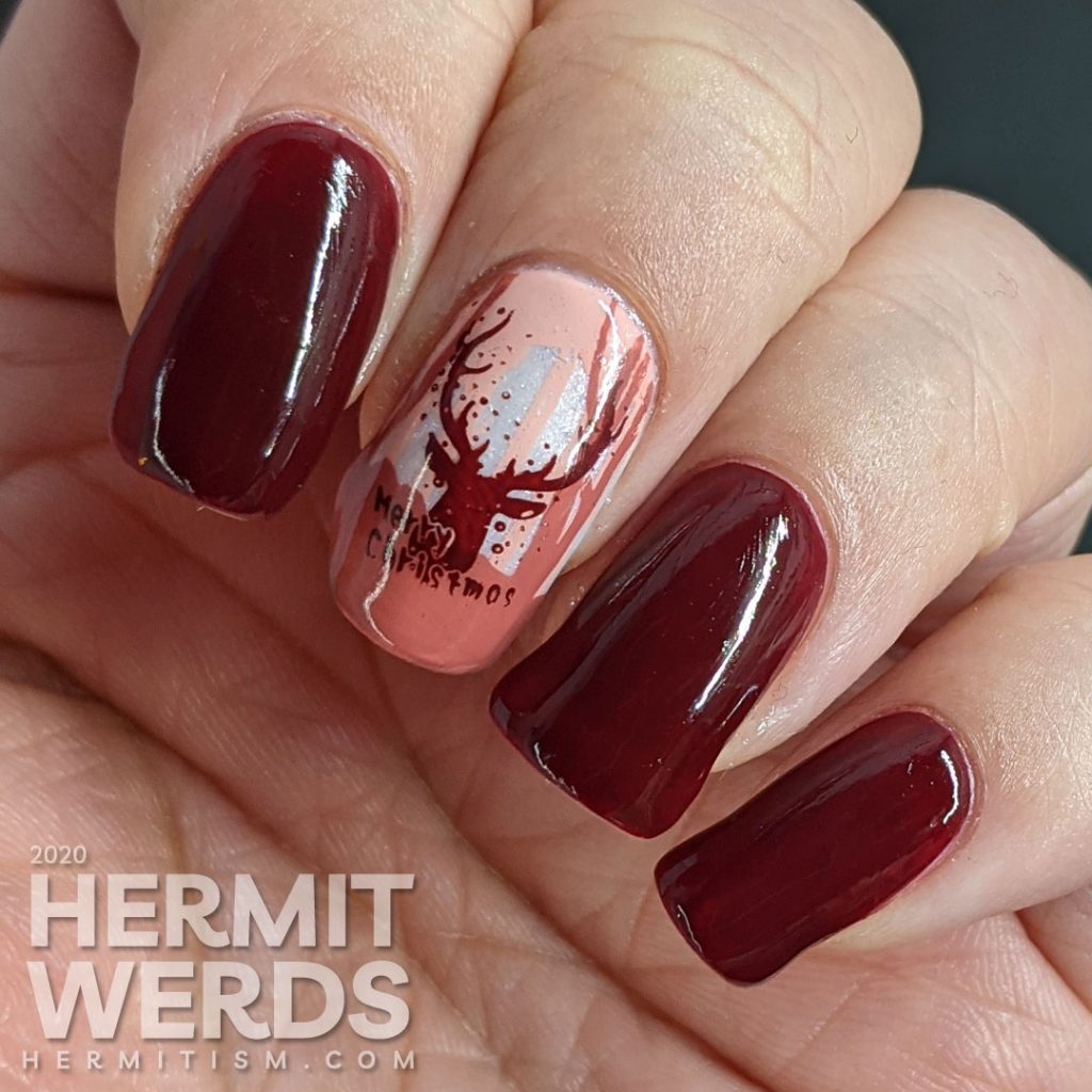 Monochrome red reindeer nail art with deep red polishes and a wintery scene created from layered stamping. Merry Christmas!