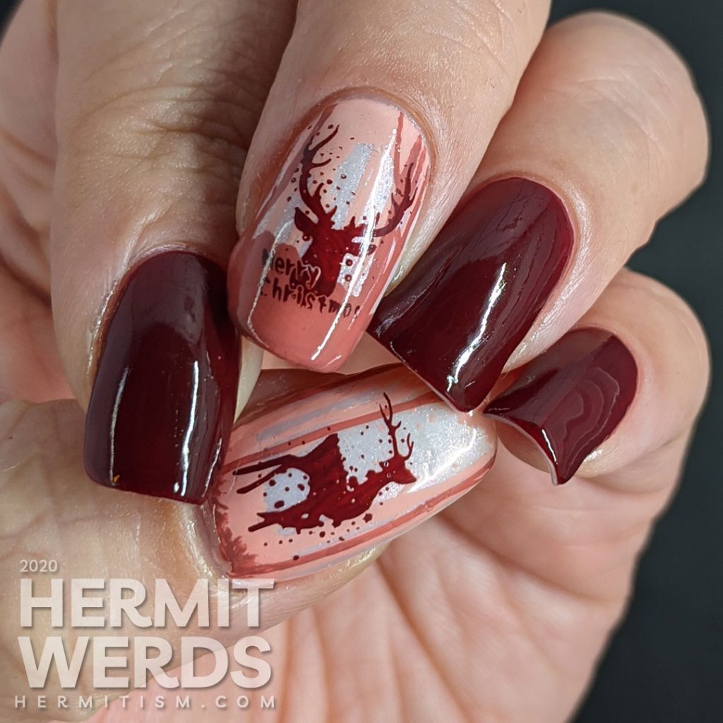 Monochrome red reindeer nail art with deep red polishes and a wintery scene created from layered stamping. Merry Christmas!