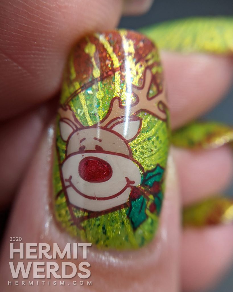 A super bling Christmas mani starting with a red/green thermal polish, bright green swirls, and dancing reindeer stamping decals.