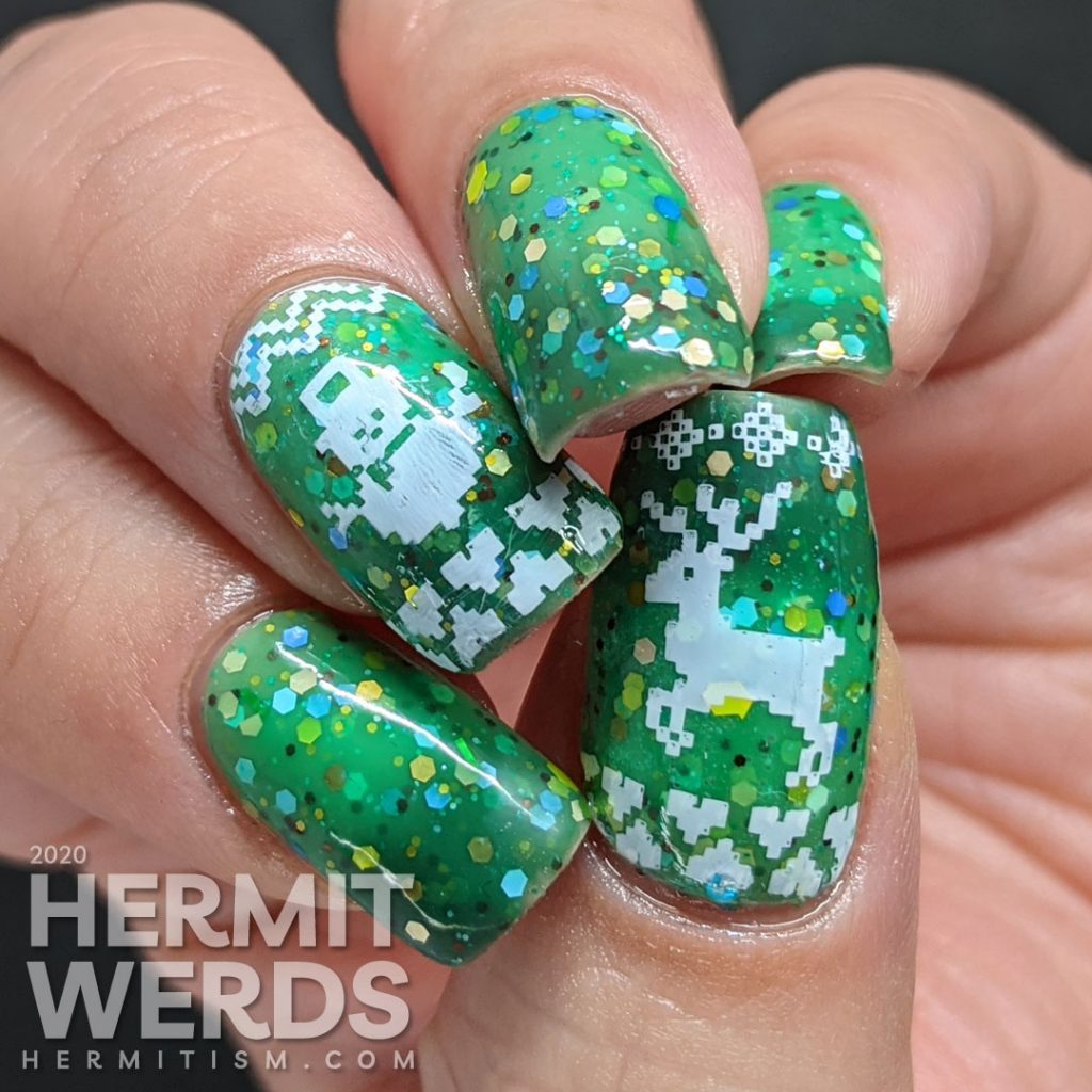 Nail art with blocky sweater pattern stamping on top of a super "tacky" light green to ultramarine green tri-thermal indie polish stuffed with glitter.