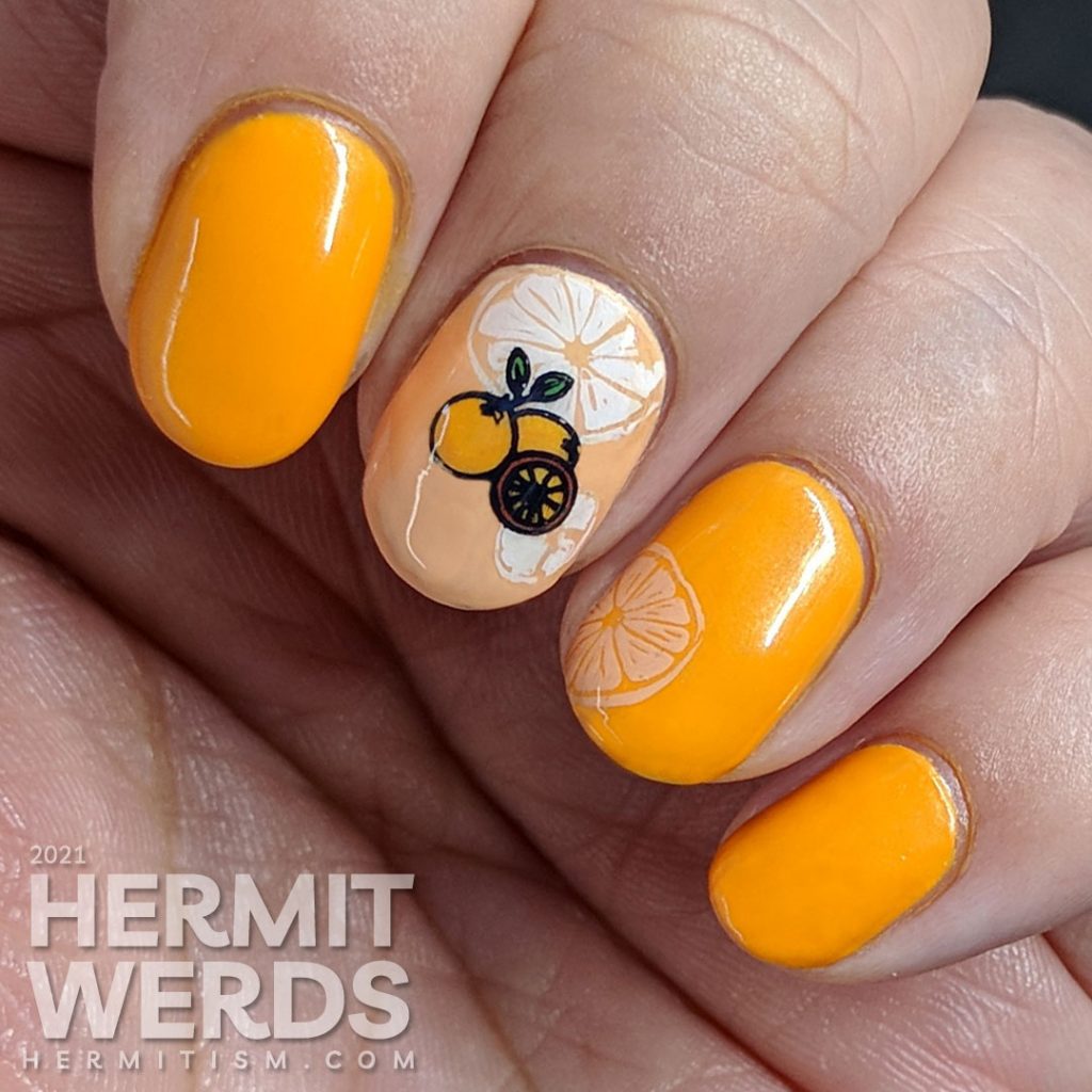 Fruit-themed bright orange nail art with orange slice and orange stamping decals on top.