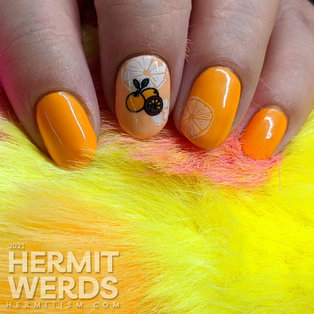 Fruit-themed bright orange nail art with orange slice and orange stamping decals on top.