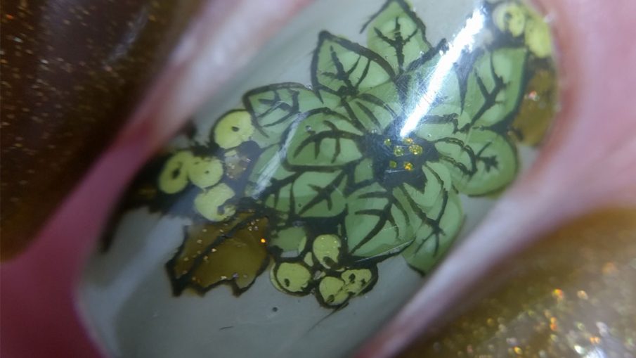 Olive Christmas art featuring accent nails with poinsettia stamping decals and a wee bird and holographic olive polish.