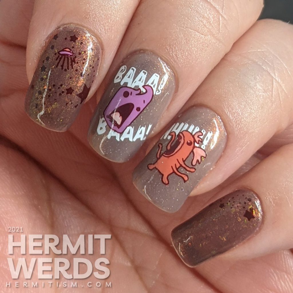 A muted red nail art with a science fiction theme. Cute aliens stamping decals scream at each other while an astronaut says "hi".