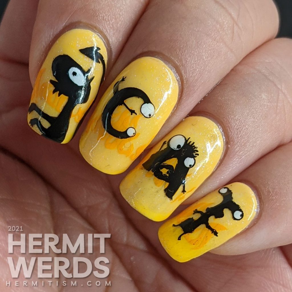 Yellow and orange nail art with the demon Luci (cat) from Netflix's Disenchanted freehand painted on top of flames.