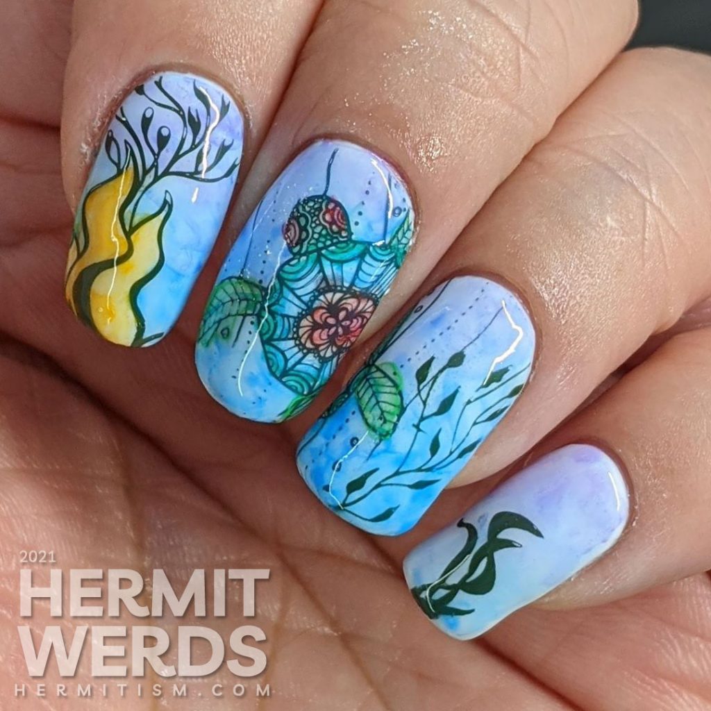 A watercolor nail art with a sea turtle with mandala-esque patterns and lots of kelp colored in with actual watercolor paint.