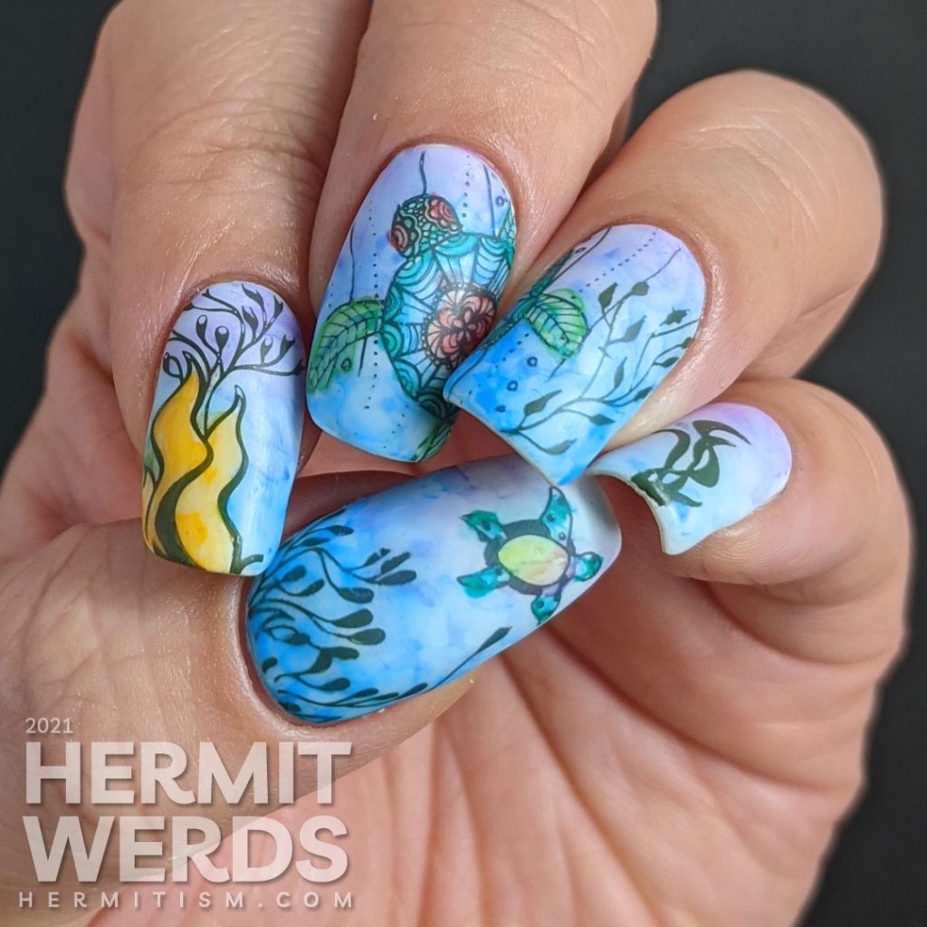 A watercolor nail art with a sea turtle with mandala-esque patterns and lots of kelp colored in with actual watercolor paint.