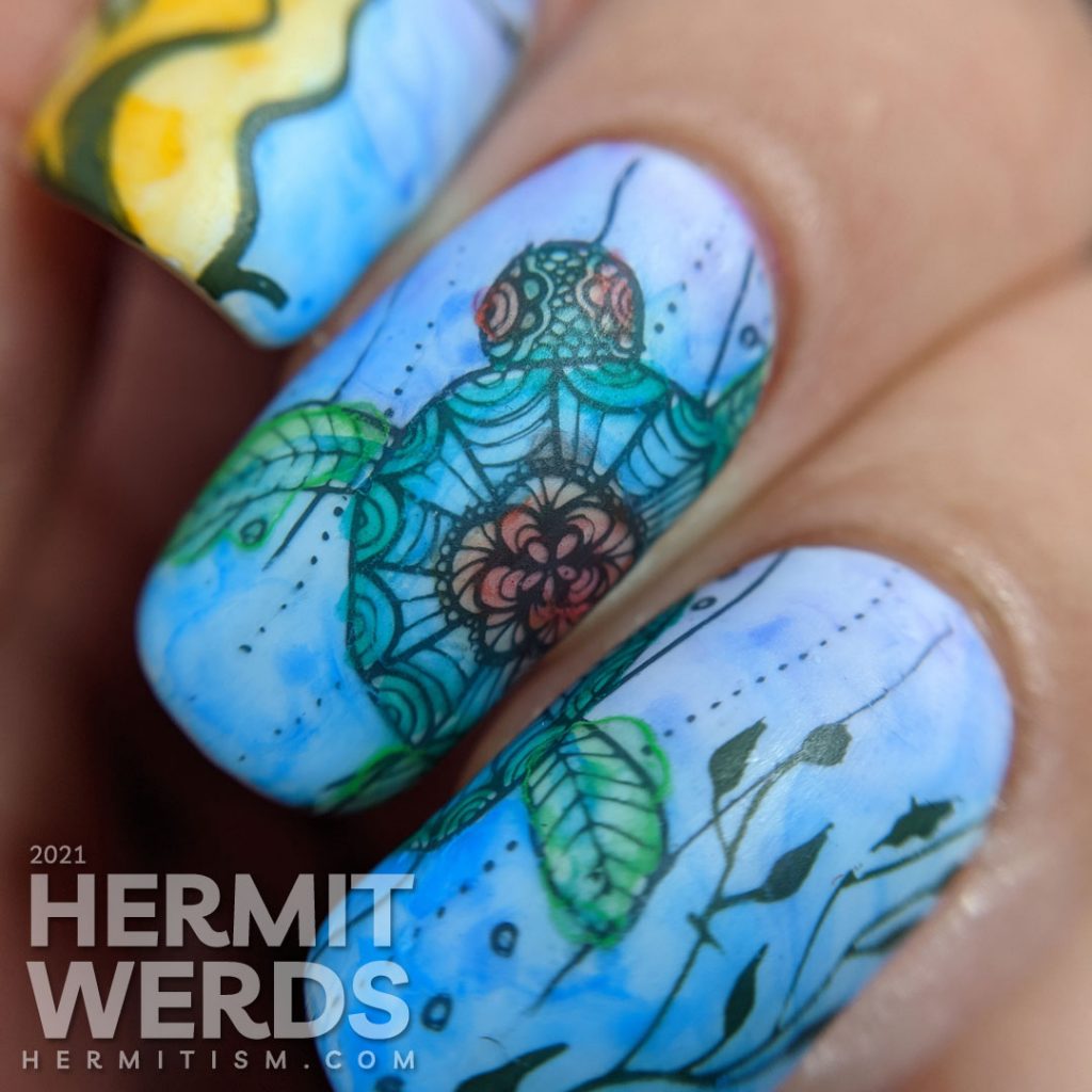A watercolor nail art with a sea turtle with mandala-esque patterns and lots of kelp colored in with actual watercolor paint.