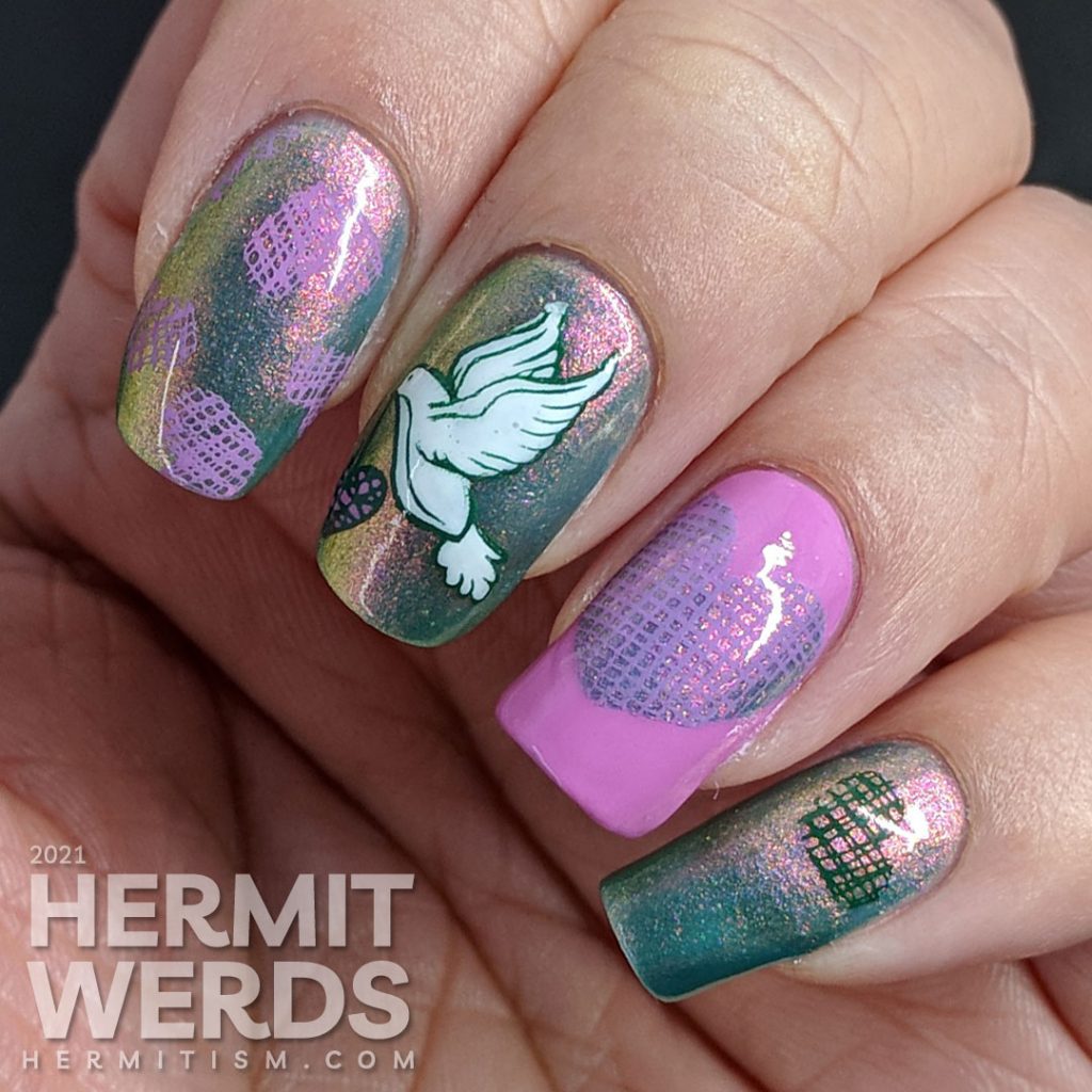 A pink to green shimmery base polish covered with soft green, purple-pink, and white stamping decals of a dove and crosshatch hearts.
